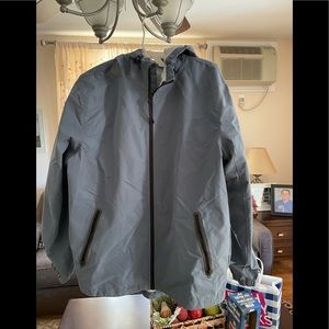 Old Navy rain jacket with hood size large. Zip closure zip pockets.